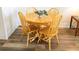 Charming dining area with round wooden table and four chairs at 357 S Mcmullen Booth Rd # 120, Clearwater, FL 33759