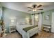 Main bedroom with barn door leading to bathroom at 103 Cypress Pond Rd # 103, Palm Harbor, FL 34683