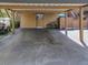 Covered carport with space for one car and a bicycle at 103 Cypress Pond Rd # 103, Palm Harbor, FL 34683