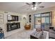 Living room with tiled floors and sliding glass doors at 103 Cypress Pond Rd # 103, Palm Harbor, FL 34683