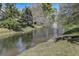 Peaceful pond with a fountain and rainbow at 103 Cypress Pond Rd # 103, Palm Harbor, FL 34683