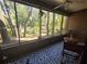 Spacious screened porch overlooking wooded area at 103 Cypress Pond Rd # 103, Palm Harbor, FL 34683