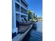 Relaxing waterfront deck with two lounge chairs and a view of the marina at 821 Bahia Del Sol Dr # 43, Ruskin, FL 33570