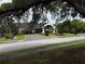 Spacious clubhouse exterior with circular driveway and landscaping at 8304 Bardmoor Blvd # 17 104, Seminole, FL 33777