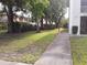 Paved pathway meanders through lush landscaping, providing a serene walkway at 8304 Bardmoor Blvd # 104, Seminole, FL 33777