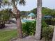 Refreshing pool area with a cabana and lush tropical landscaping at 8304 Bardmoor Blvd # 104, Seminole, FL 33777