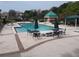 Refreshing community pool with ample seating and shade structures at 8304 Bardmoor Blvd # 104, Seminole, FL 33777