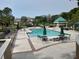 Inviting swimming pool with plenty of lounge chairs and umbrellas at 8304 Bardmoor Blvd # 104, Seminole, FL 33777