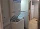 Convenient laundry room with stackable washer and dryer at 8304 Bardmoor Blvd # 104, Seminole, FL 33777