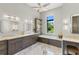 Luxurious bathroom with double vanity and soaking tub at 266 8Th N Ave, Tierra Verde, FL 33715