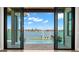 Stunning water view visible through sliding glass doors from inside the home at 266 8Th N Ave, Tierra Verde, FL 33715