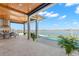 Covered patio overlooking pool and bay at 266 8Th N Ave, Tierra Verde, FL 33715