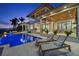 Luxury pool and patio area with lounge chairs, fire pit, and water views at 266 8Th N Ave, Tierra Verde, FL 33715