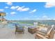 Stunning waterfront pool with fire pit and lounge chairs at 266 8Th N Ave, Tierra Verde, FL 33715