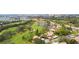 Aerial view of community with golf course and waterfront access at 6302 Pelican Creek Xing # A, St Petersburg, FL 33707