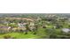 Aerial view of community situated on a golf course at 6302 Pelican Creek Xing # A, St Petersburg, FL 33707