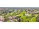 Aerial view of community near golf course and water at 6302 Pelican Creek Xing # A, St Petersburg, FL 33707