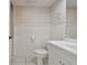 Simple bathroom with white vanity and toilet at 6302 Pelican Creek Xing # A, St Petersburg, FL 33707