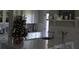 Bright kitchen with white cabinets, quartz countertops and a small Christmas tree at 6302 Pelican Creek Xing # A, St Petersburg, FL 33707