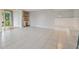 Open and bright living area with tile flooring at 6302 Pelican Creek Xing # A, St Petersburg, FL 33707