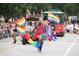 A vibrant LGBTQ+ parade with rainbow flags and festive attire at 6302 Pelican Creek Xing # A, St Petersburg, FL 33707