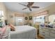 Cozy bedroom featuring a double bed, dresser, and ceiling fan at 247 93Rd N Ave, St Petersburg, FL 33702