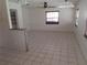 Spacious dining area with tile floors and built-in shelving at 247 93Rd N Ave, St Petersburg, FL 33702