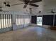 Large Florida room with multiple ceiling fans and window coverings at 247 93Rd N Ave, St Petersburg, FL 33702
