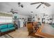 Spacious Florida room with bar, seating area, and mini-fridge at 247 93Rd N Ave, St Petersburg, FL 33702