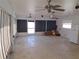 Spacious Florida room with ceiling fans and window coverings at 247 93Rd N Ave, St Petersburg, FL 33702
