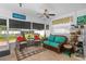 Cozy Florida room with seating and screened windows at 247 93Rd N Ave, St Petersburg, FL 33702