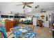 Relaxing Florida room with bar, seating, and large windows at 247 93Rd N Ave, St Petersburg, FL 33702