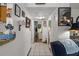 Bright hallway with decorative wall art leading to other rooms at 247 93Rd N Ave, St Petersburg, FL 33702