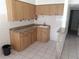 Wood cabinets, granite countertops and tile flooring in kitchen at 247 93Rd N Ave, St Petersburg, FL 33702