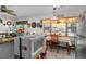 Bright kitchen with wood cabinets and a dining area at 247 93Rd N Ave, St Petersburg, FL 33702