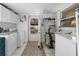 Laundry room with washer, dryer, cabinets, and exterior access at 247 93Rd N Ave, St Petersburg, FL 33702