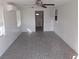 Bright living room featuring tile flooring and a ceiling fan at 247 93Rd N Ave, St Petersburg, FL 33702
