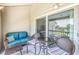 Relaxing balcony featuring wicker furniture and tranquil water views at 1375 Pinellas Bayway S # 29, Tierra Verde, FL 33715