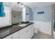 Bathroom boasts granite countertops, a large vanity, and a shower/tub combo at 1375 Pinellas Bayway S # 29, Tierra Verde, FL 33715