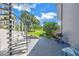 Outdoor patio with spiral staircase and green space at 1375 Pinellas Bayway S # 29, Tierra Verde, FL 33715