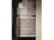 Close-up of air handler with visible filter and documentation at 1806 Mariner Dr # 214, Tarpon Springs, FL 34689