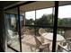 Exterior balcony with table and chairs, perfect for relaxation and outdoor enjoyment at 1806 Mariner Dr # 214, Tarpon Springs, FL 34689