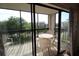 Enjoy outdoor living on this condo balcony, featuring a round table and seating with scenic views at 1806 Mariner Dr # 214, Tarpon Springs, FL 34689