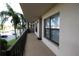 Balcony exterior view with palm trees and waterfront view at 1806 Mariner Dr # 214, Tarpon Springs, FL 34689