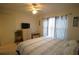 Bedroom featuring a ceiling fan, and closet, and natural light at 1806 Mariner Dr # 214, Tarpon Springs, FL 34689