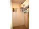 Interior view of closet featuring shelving, hanging rods, and storage solutions at 1806 Mariner Dr # 214, Tarpon Springs, FL 34689
