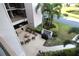 Community outdoor area with seating, grill, and greenery at 1806 Mariner Dr # 214, Tarpon Springs, FL 34689