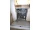 Dishwasher with an open door and visible racks at 1806 Mariner Dr # 214, Tarpon Springs, FL 34689