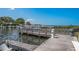 Waterfront view showcasing the wooden dock for boating and water activities at 1806 Mariner Dr # 214, Tarpon Springs, FL 34689