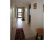 Entryway with tile flooring, hallway, storage, and access to other rooms in the home at 1806 Mariner Dr # 214, Tarpon Springs, FL 34689